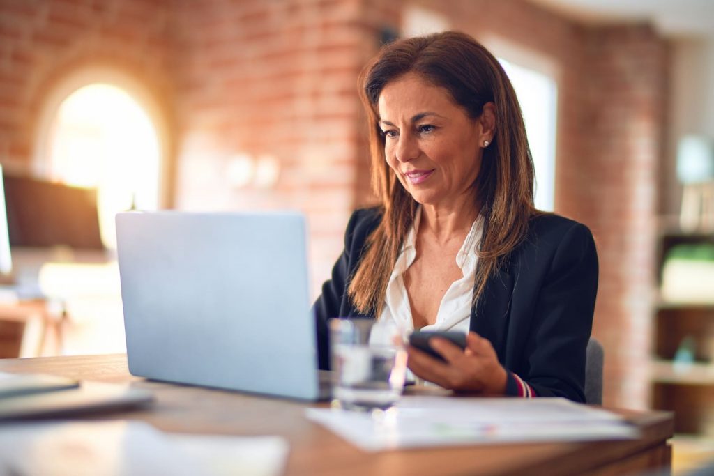 cambridge thinking space career coaching woman smiling at laptop