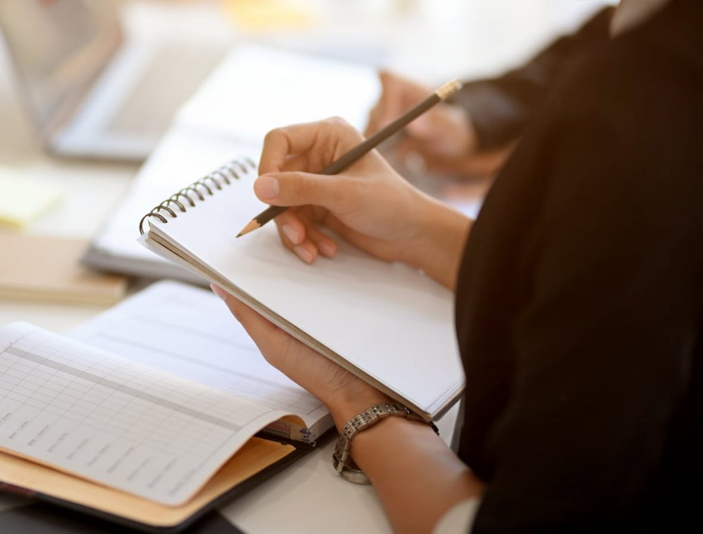 cambridge thinking space woman writing in notebook e1646226900184